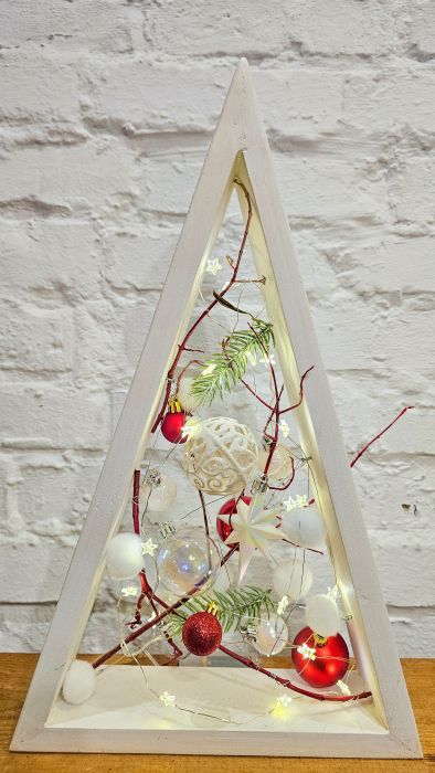 Decorative triangular Christmas tree with red balls