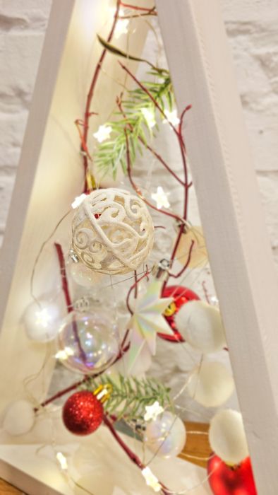 Decorative triangular Christmas tree with red balls