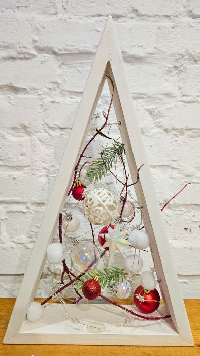 Decorative triangular Christmas tree with red balls