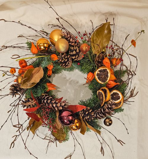 Christmas wreath in classic colors and dried fruits