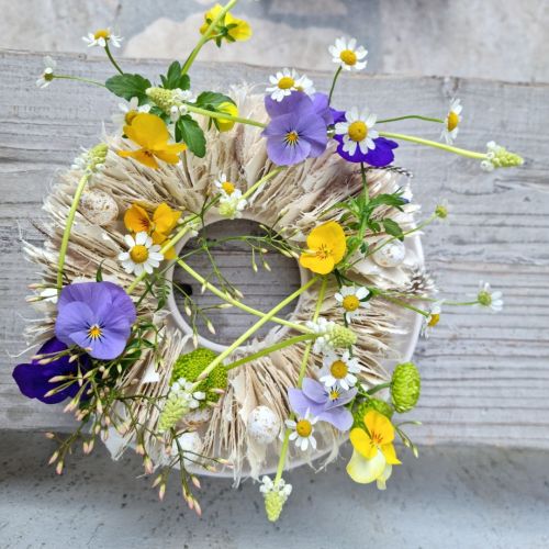 Easter wreath with violets and daisies