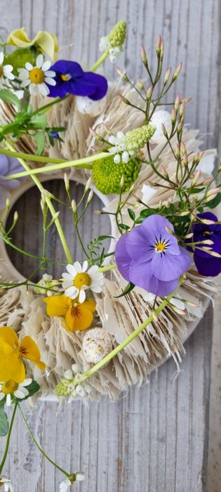 Easter wreath with violets and daisies