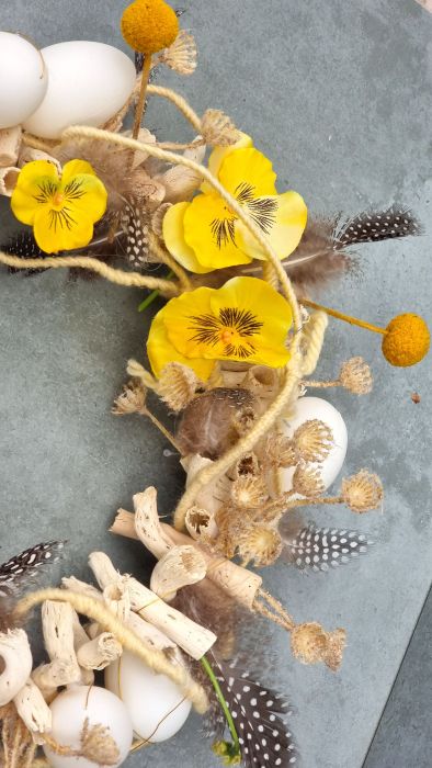 Easter wreath with viola and craspedia