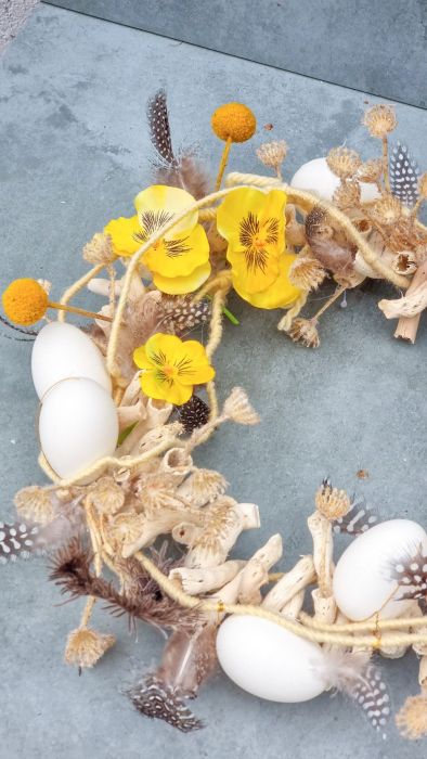 Easter wreath with viola and craspedia